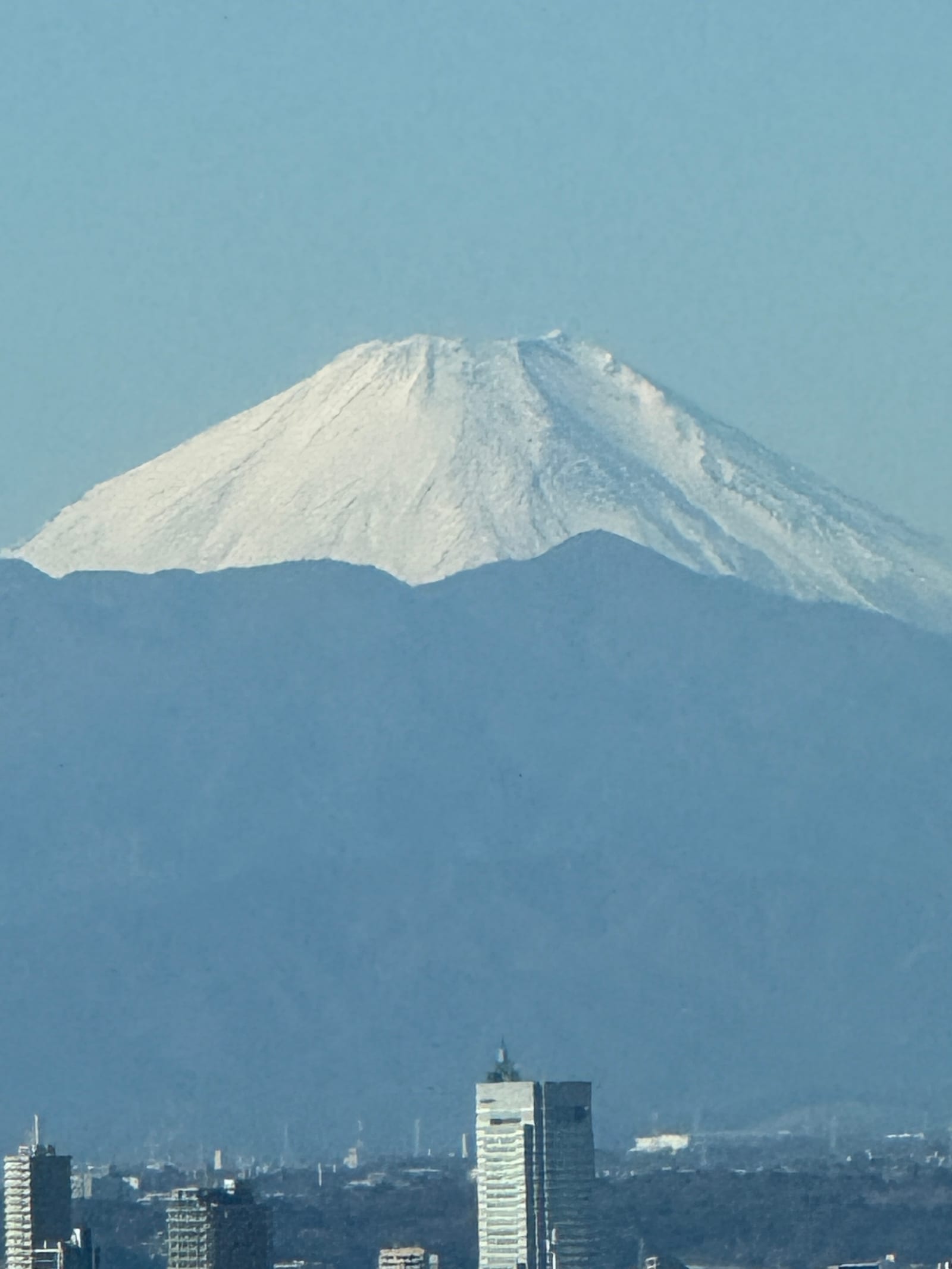 Snow-capped Mt Fuji, zoomed in with a phone from Tokyo Tower's Main Deck.