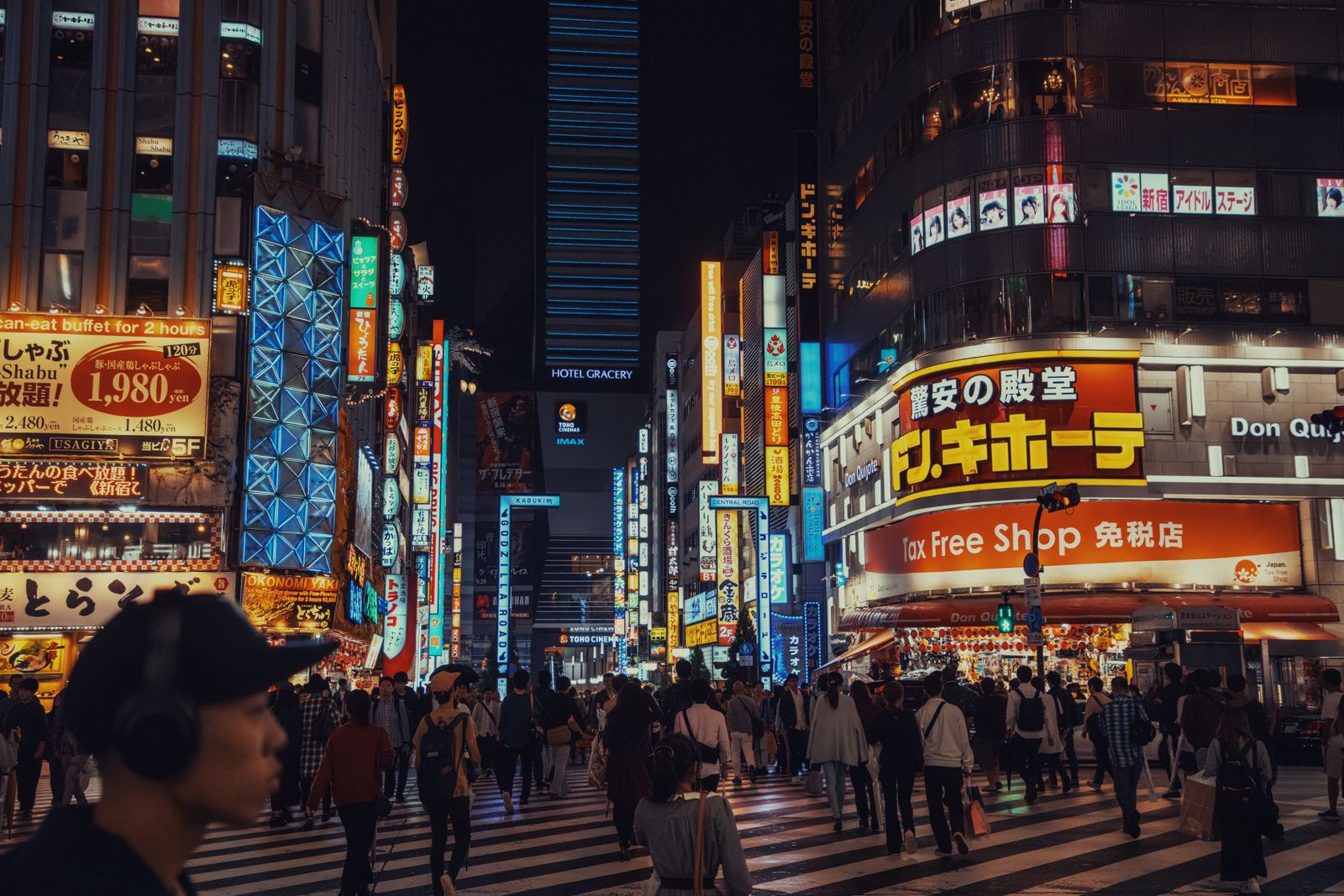 Kabukicho at night, a Don Quijote storefront with an orange Tax Free Shop band beneath the sign.