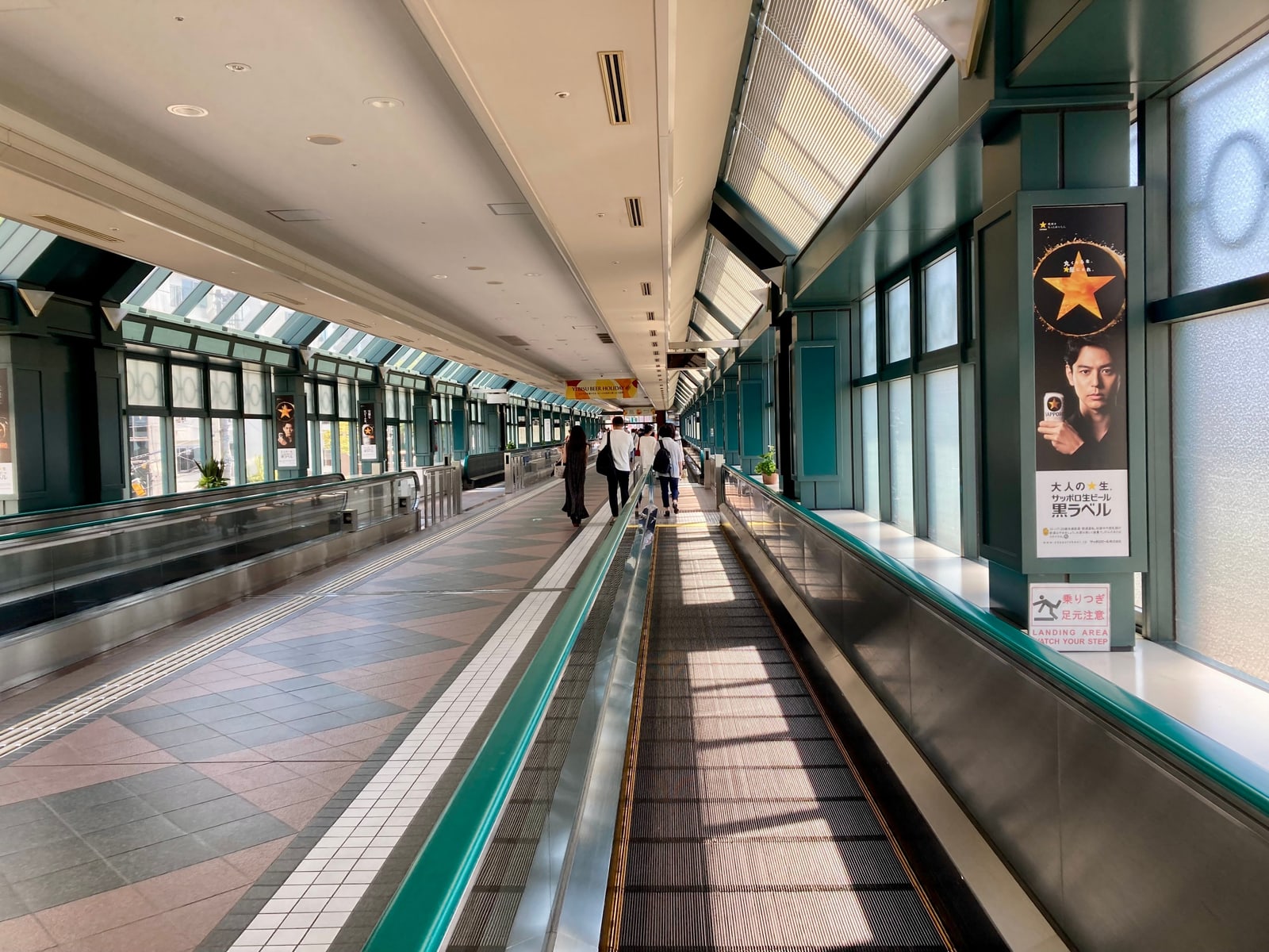 The covered moving walkway between Ebisu Station and Yebisu Garden Place, skylights overhead