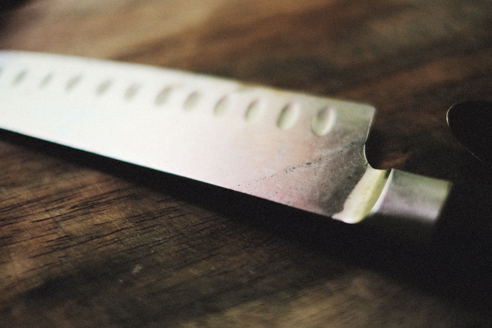 A close view of a granton edge, the row of oval dimples ground into the blade face.