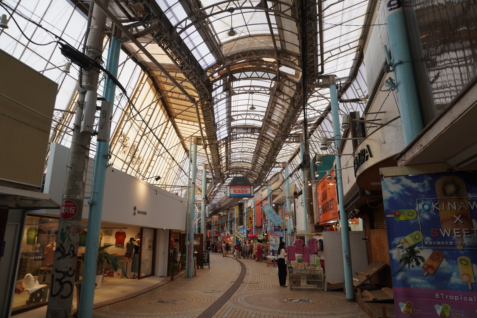 A covered shopping arcade in central Naha, with shops on both sides