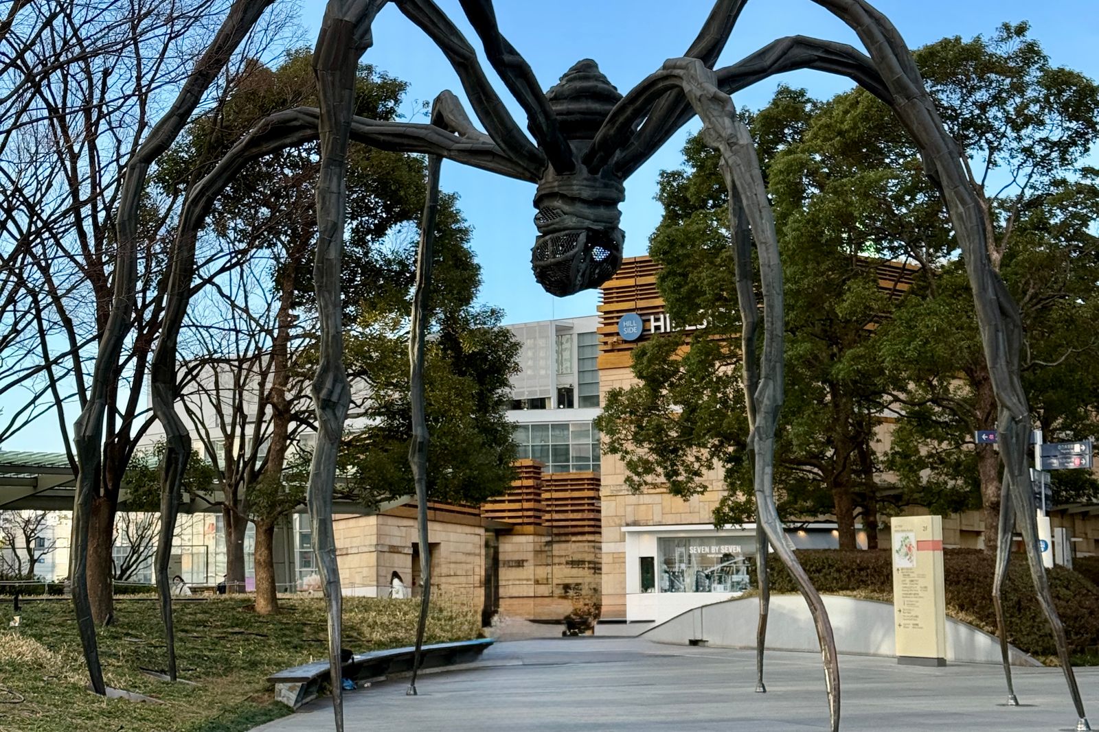 The giant spider sculpture at Roppongi Hills standing over a paved plaza