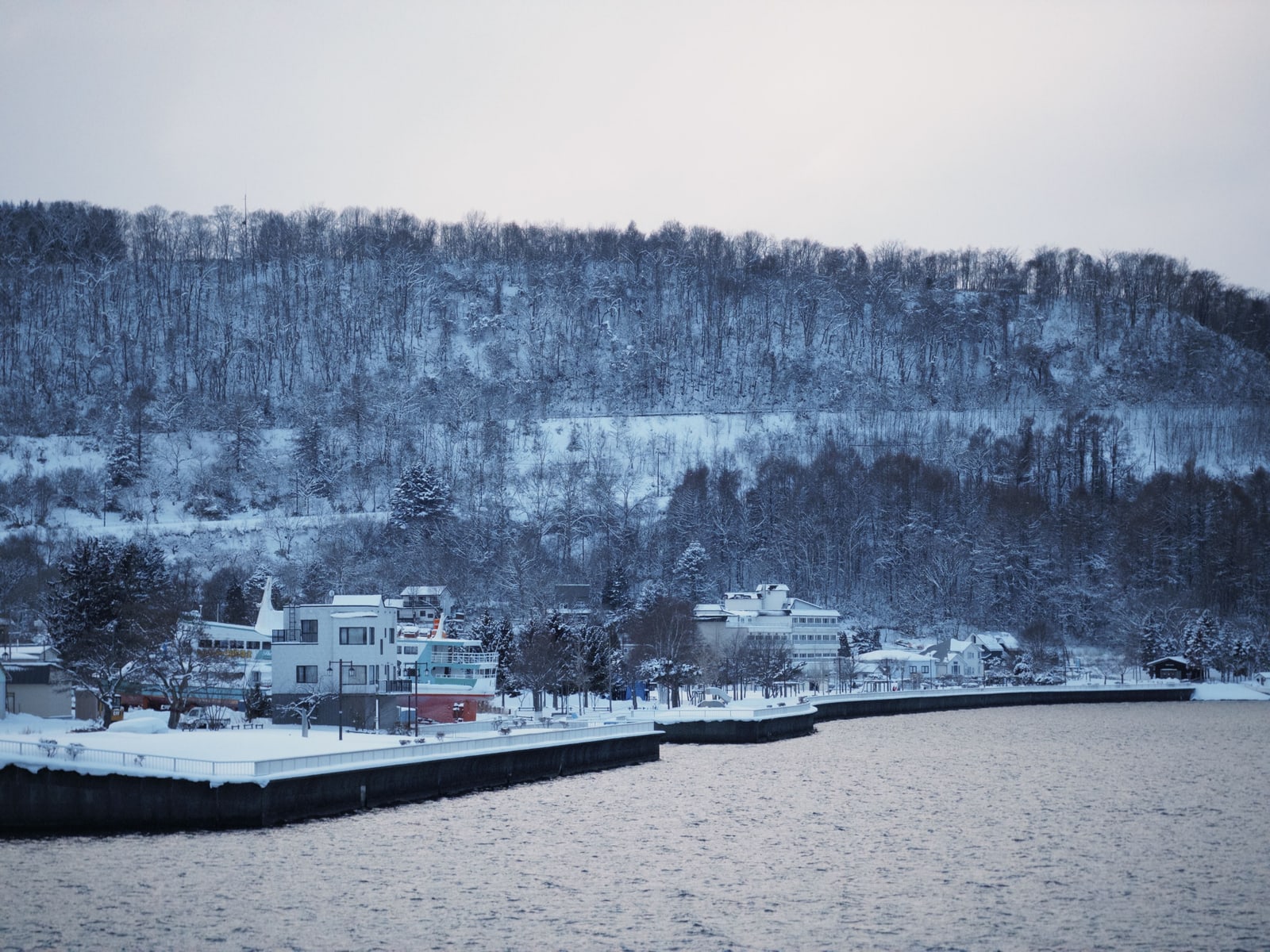 Snow-covered buildings along the shore of Lake Toya in winter, Hokkaido