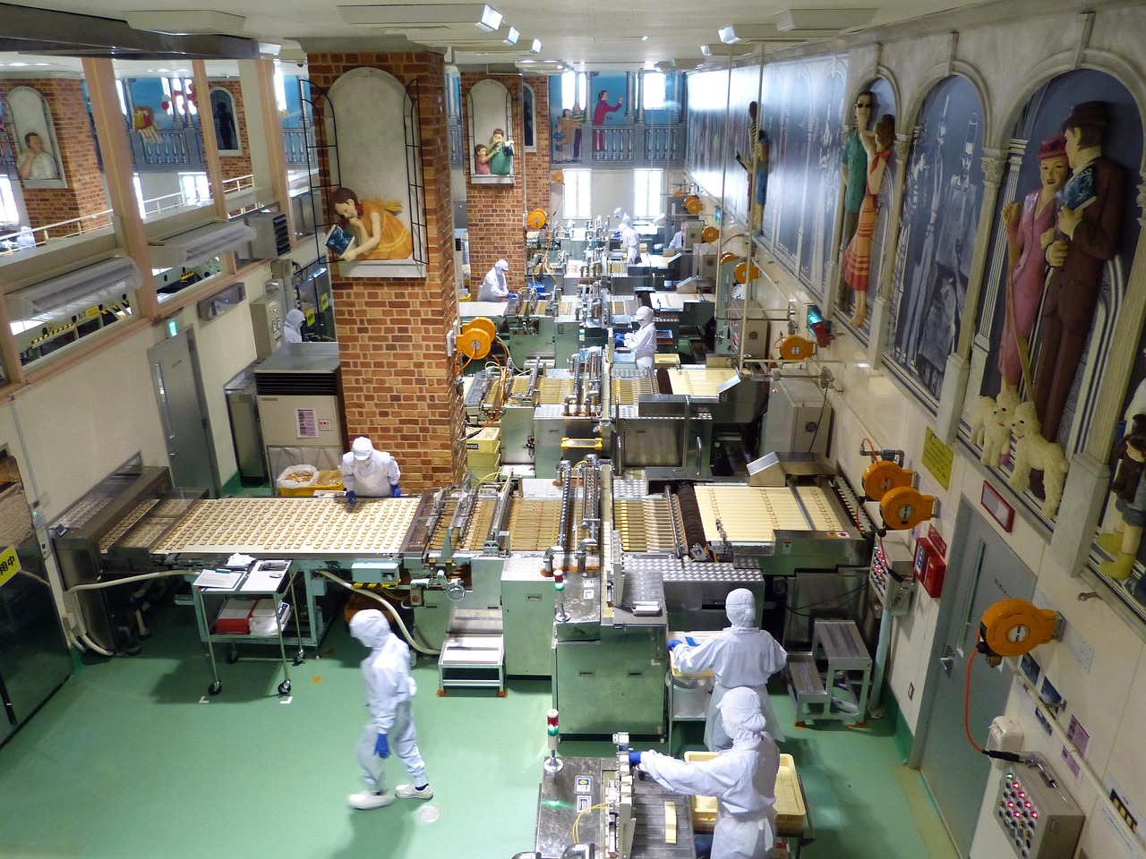 The biscuit production line at Shiroi Koibito Park seen from above, workers in white clean-room suits