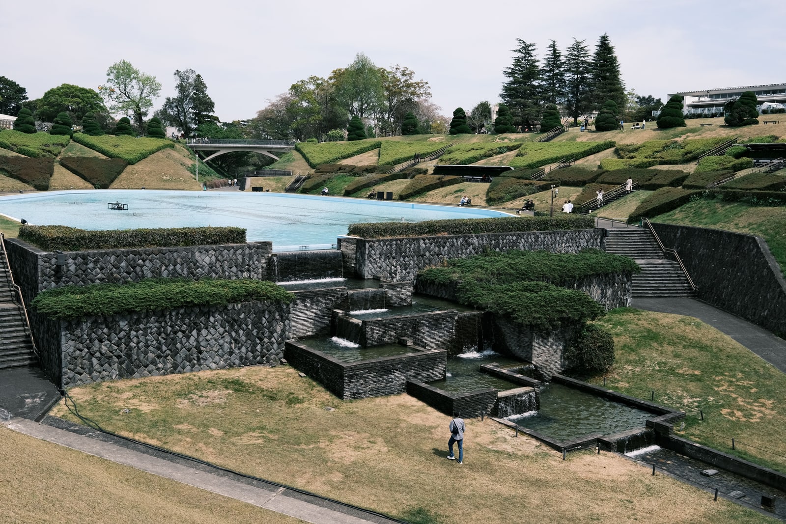 Terraced lawns and stone cascades around a large pool at Hamamatsu Flower Park