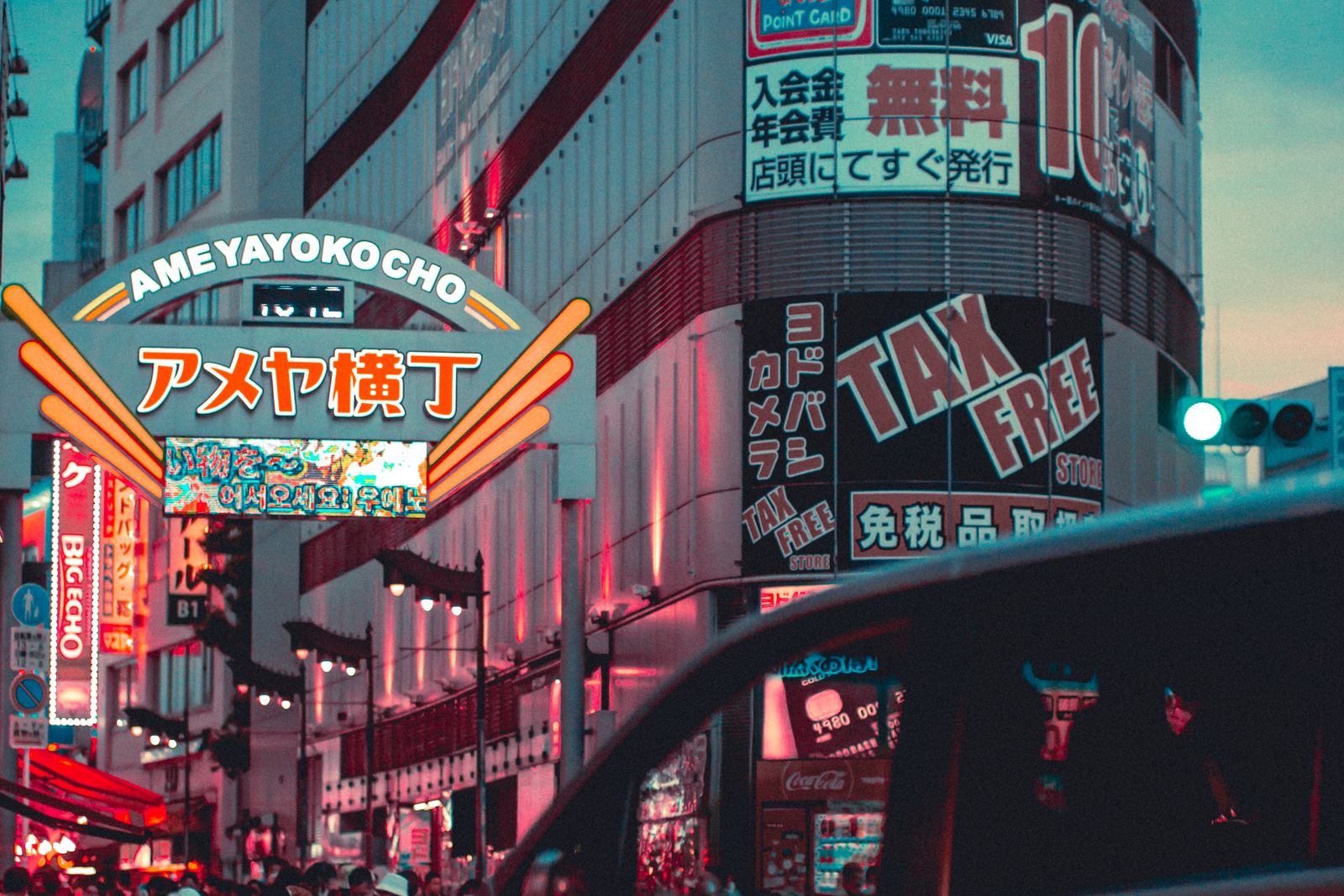 Ameyoko in the evening, small independent shops lining the street under close-packed signage.