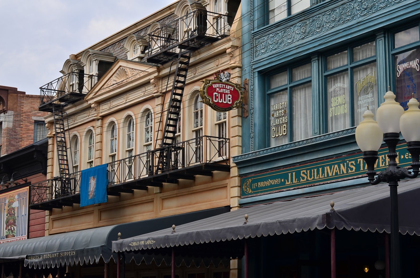 American Waterfront storefront facades at Tokyo DisneySea, with painted set-dressing signage.
