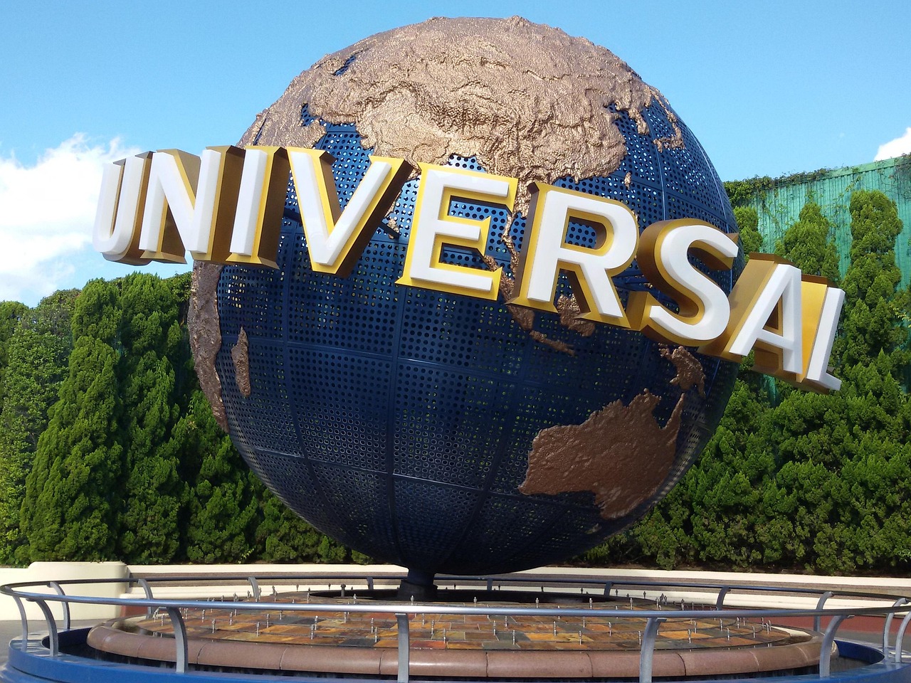 A close view of the Universal globe sign at the park entrance in Osaka.