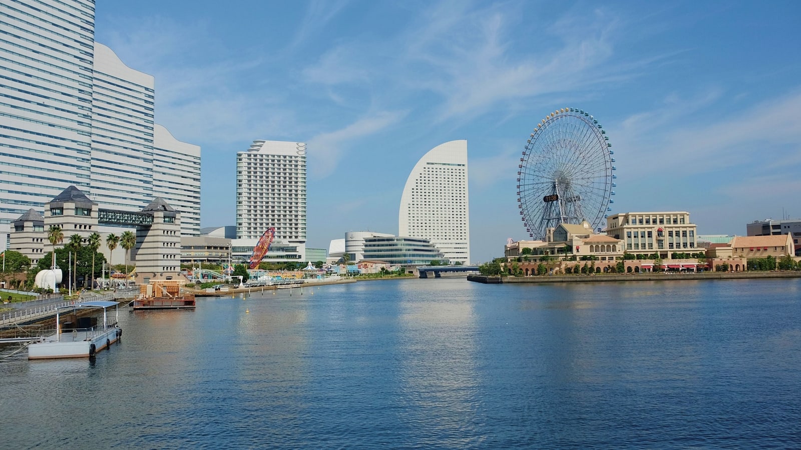 The Cosmo Clock 21 Ferris wheel on the right shore and Minato Mirai high-rises across the water on a clear day